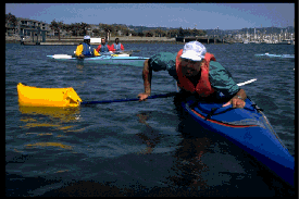 Practicing wet exits with a paddle float.